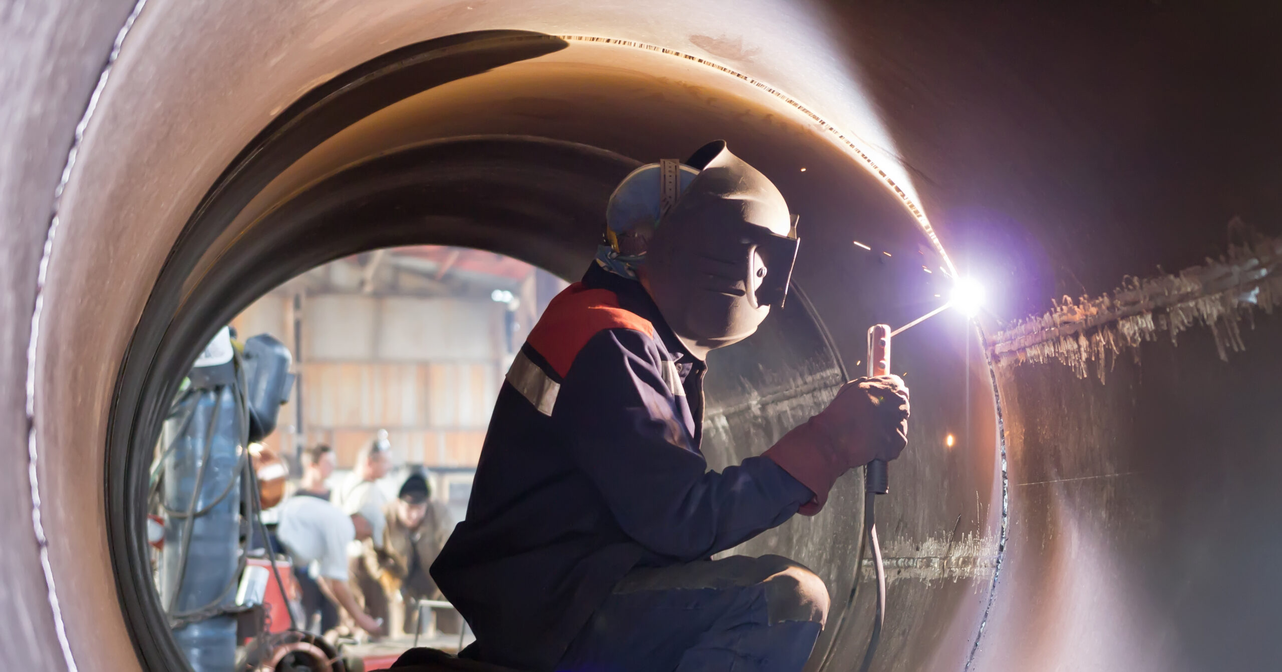 welder weld root weld from inside of big pipe