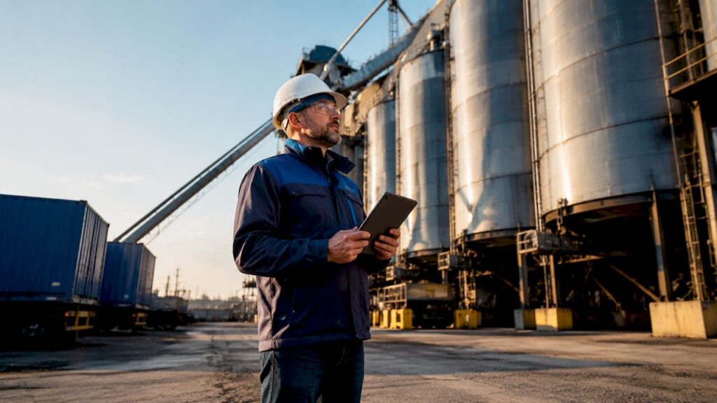 Engineer monitoring bulk transport workflow in control room