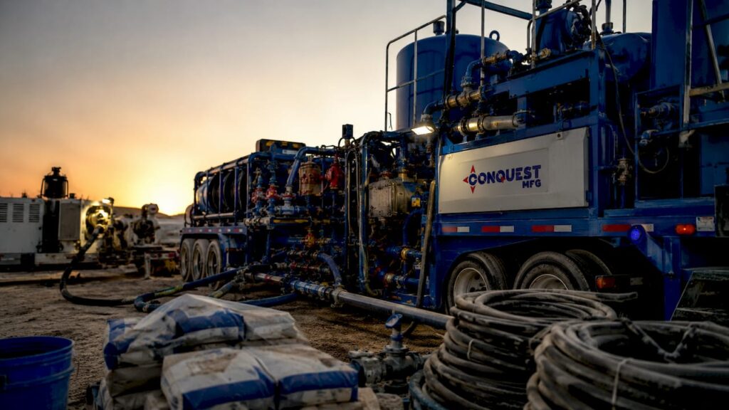 Oilfield cementing equipment setup with company logo