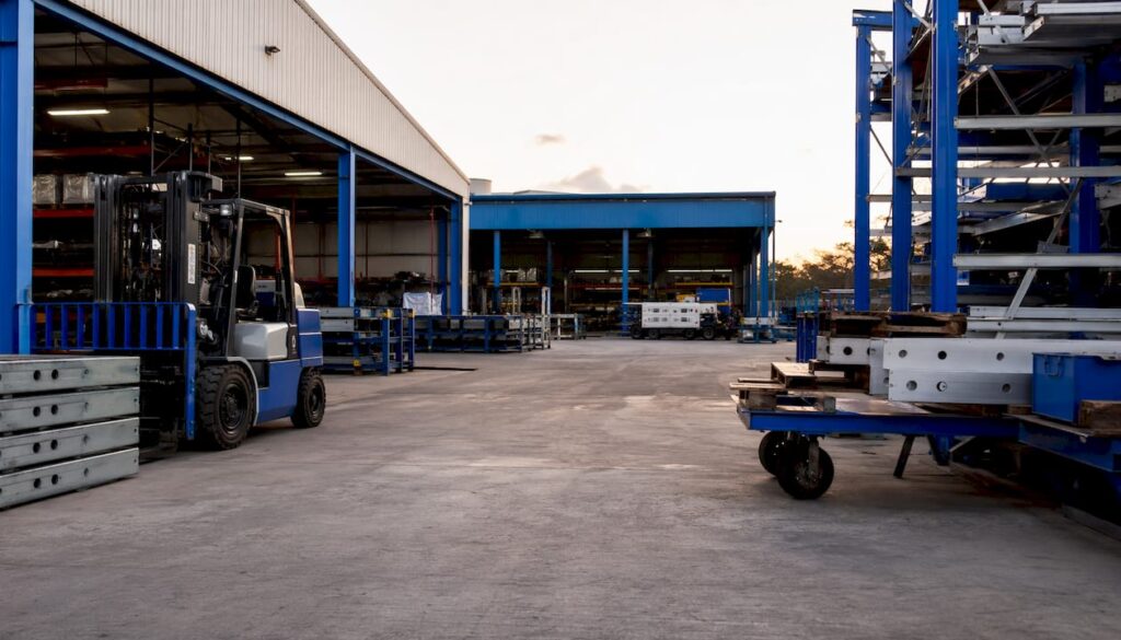 Facility logistics equipment in industrial workshop with logo