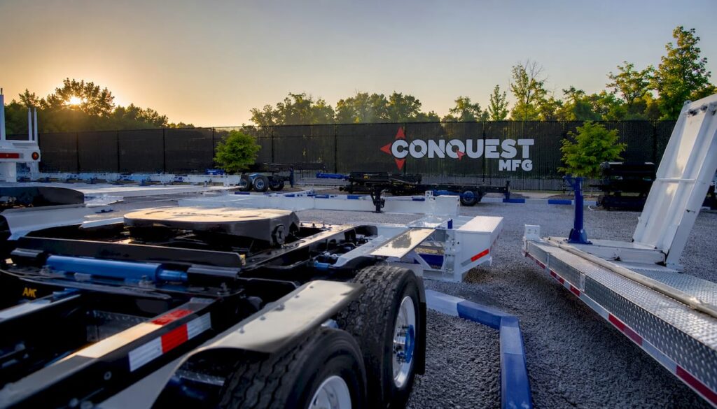 Conquest Mfg logo and assembly line in factory