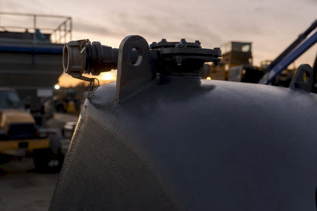 Close-up detail of frac tank steel fittings and surface
